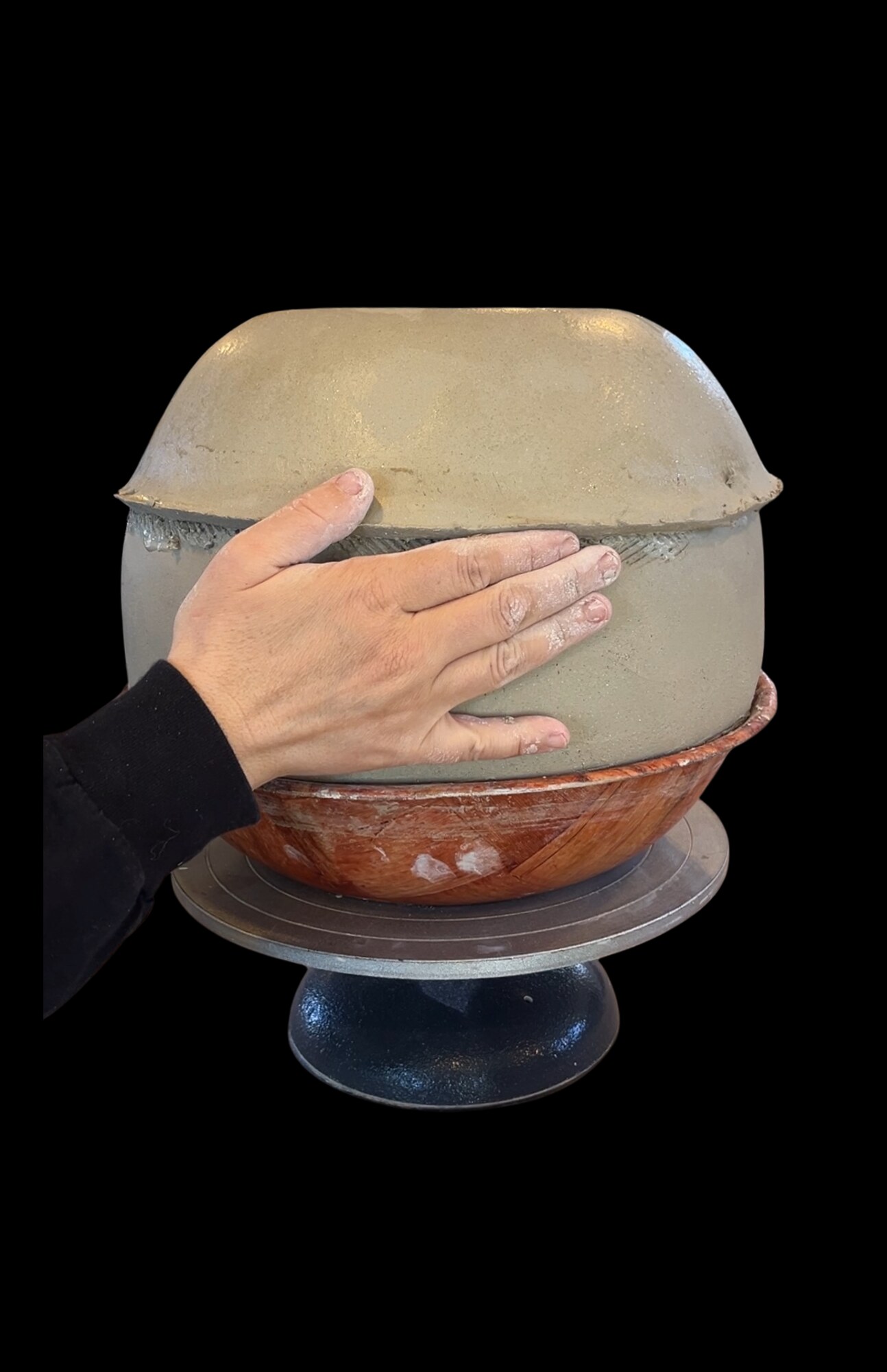 Hands shaping a large clay vessel for Morgan Peck at KINZA Kōbō.