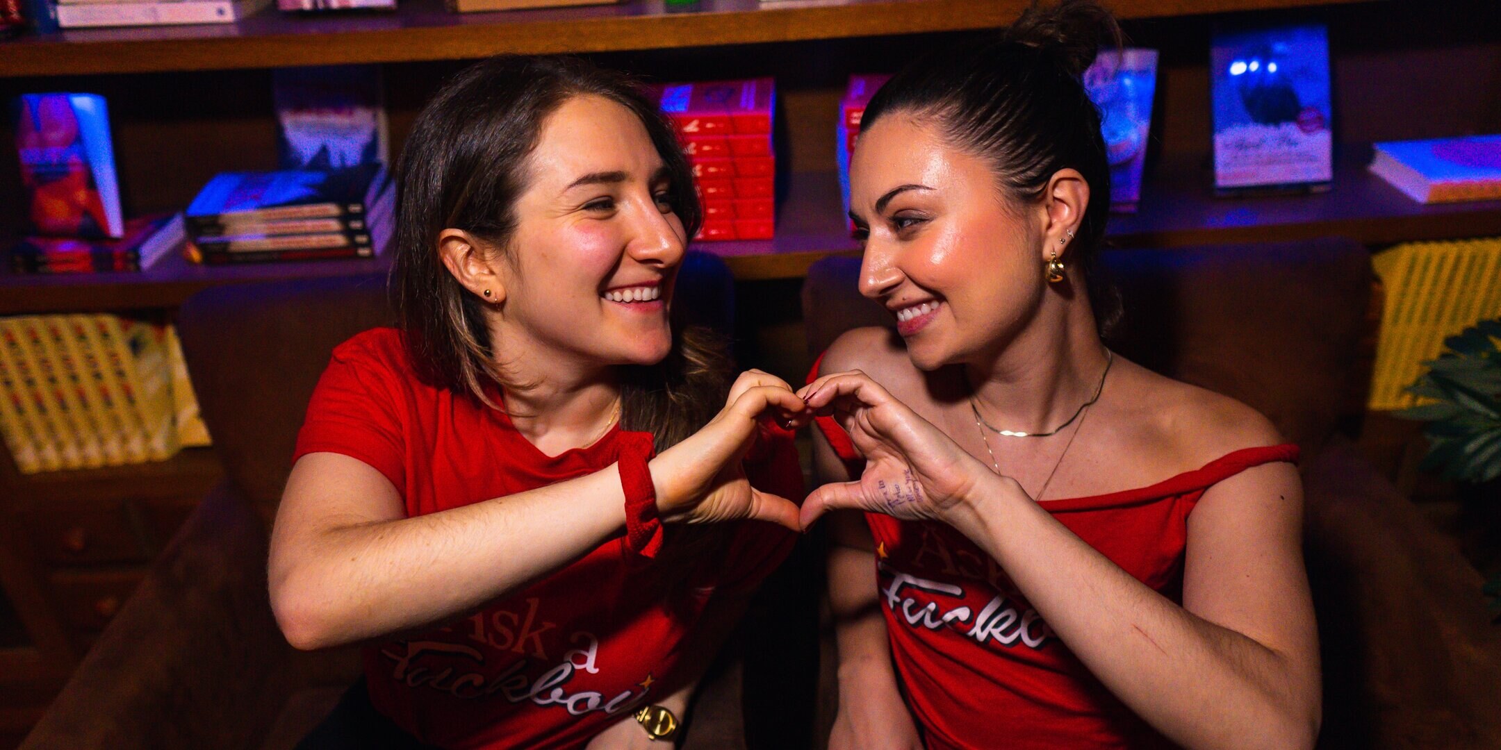 Two performers making a heart shape with their hands at Dynasty Typewriter.