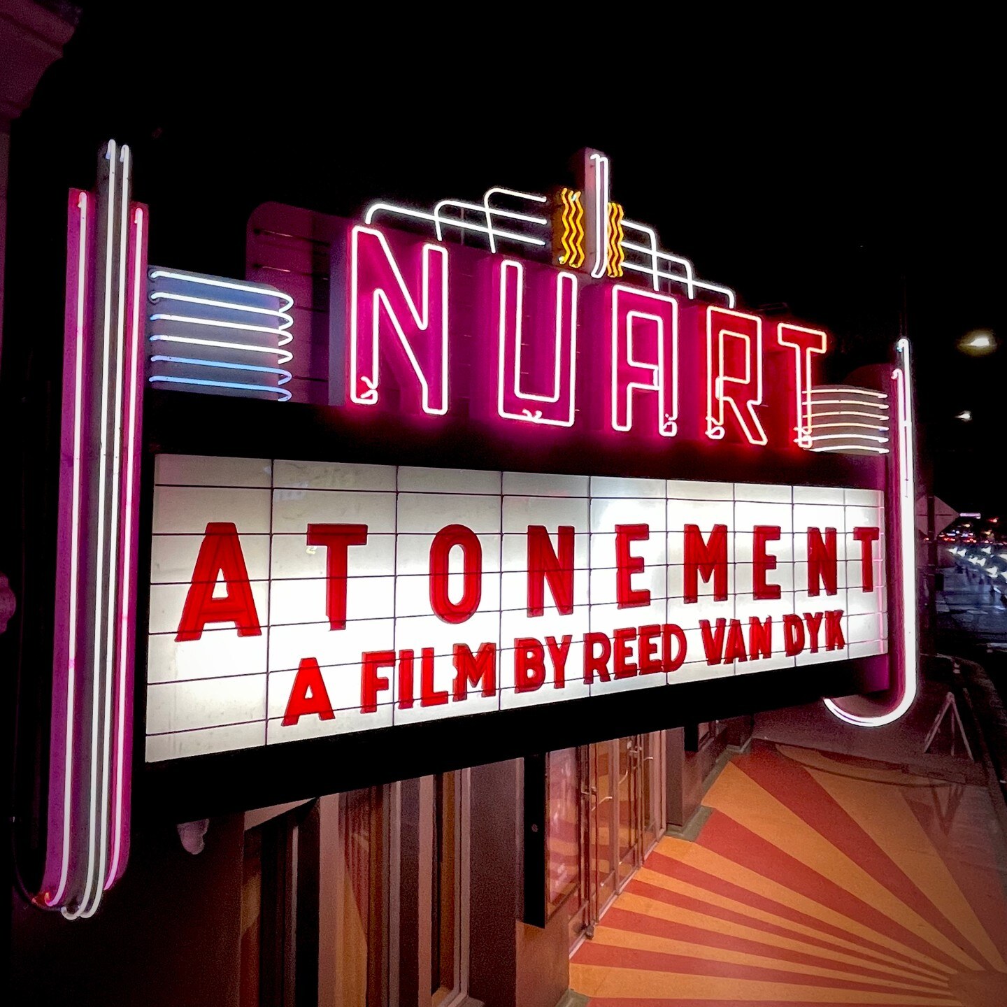 Nuart Theatre marquee displaying Atonement, a film by Reed Van Dyk