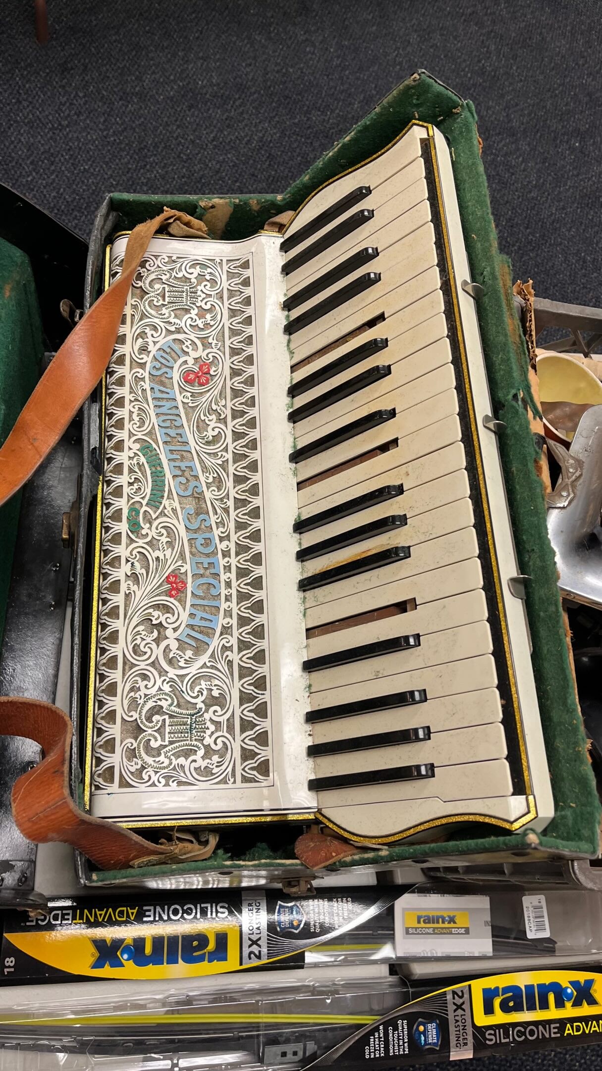 Vintage accordion photographed among items in the Burbank Museum store room sale